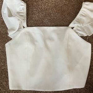 Alice and Olivia top white with small stain that will come out